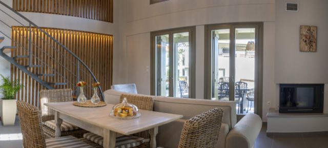 Dining table and fireplace, the patio doors open