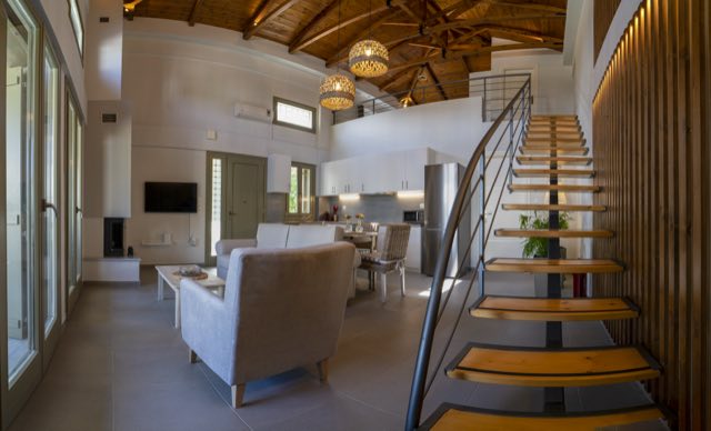 The living room, the staircase and the loft above