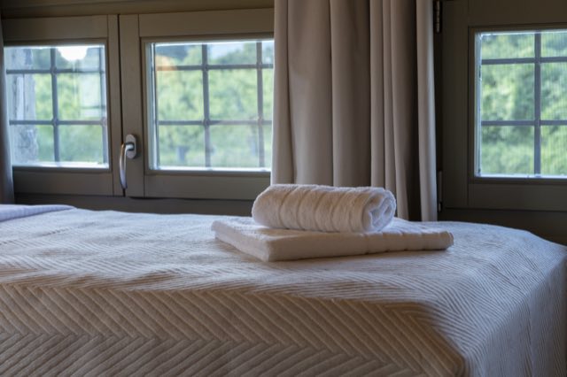 A single bed by the loft bedroom window