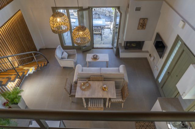 Looking down from the loft over the living room