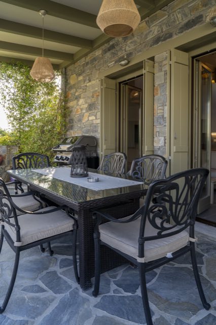 The patio dining table under the pergola