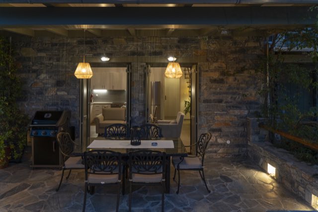 The patio table under the lanterns at night
