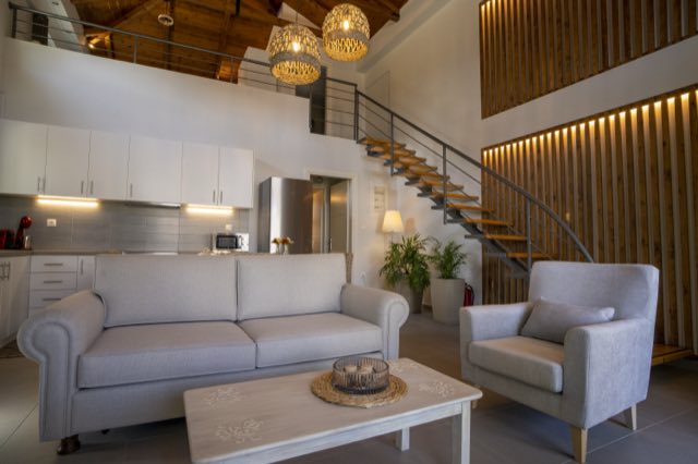 The living room under the woven pendant lights