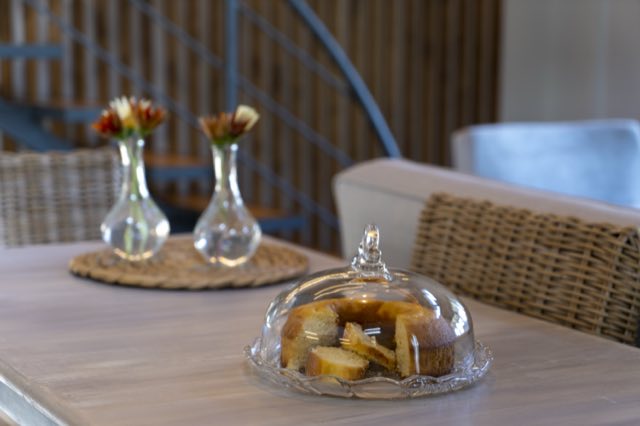 Flowers and cake laid on the dining table