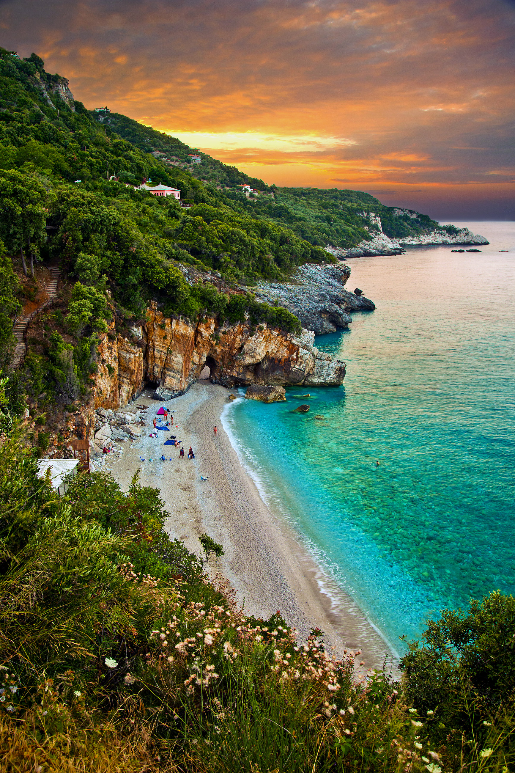 The twin coves and stone arch of Mylopotamos beach