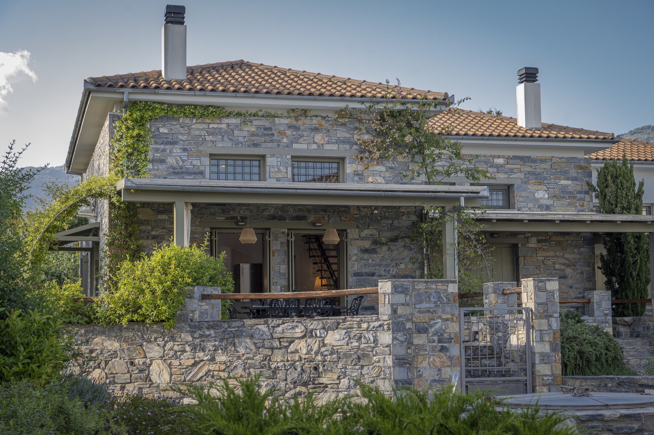 Villa Jasmine, a stone-built villa by the sea in Platanidia at dusk