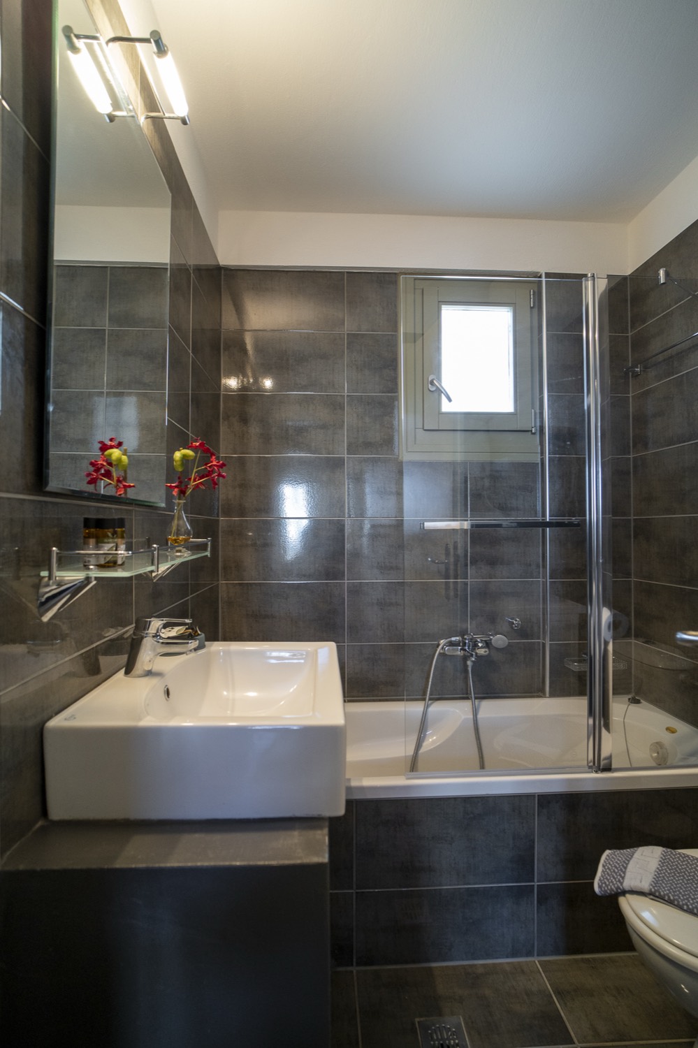 The bathtub beside the basin
