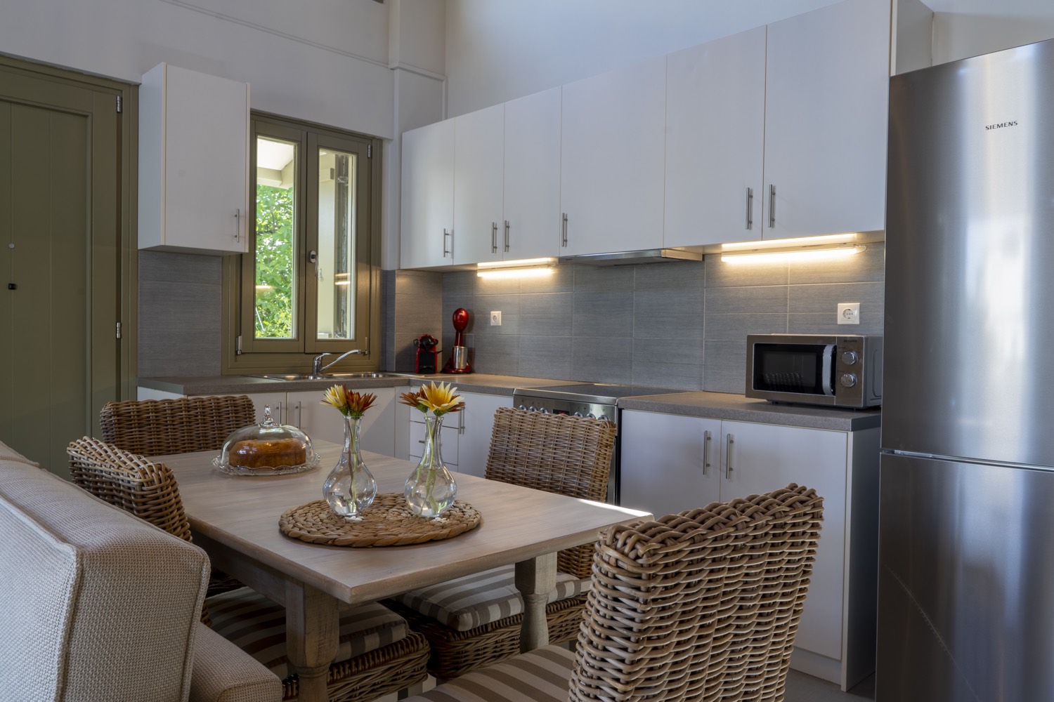 Fully equipped kitchen beside the dining table